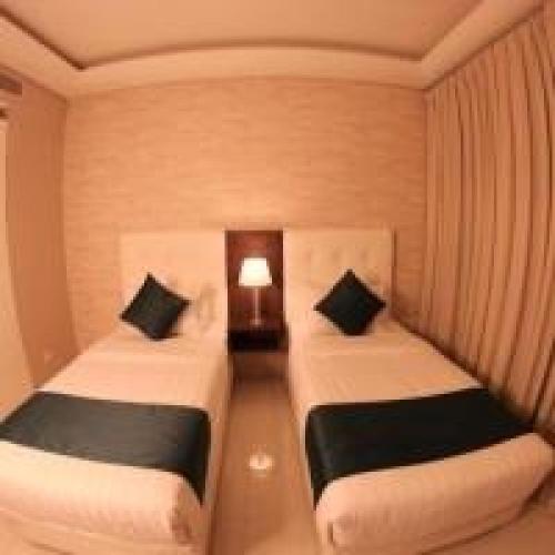 Кровать или кровати в номере Belvilla Luxury Downtown Adliya Formerly Jewel Hotel