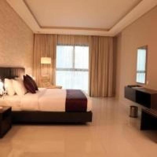 Кровать или кровати в номере Belvilla Luxury Downtown Adliya Formerly Jewel Hotel