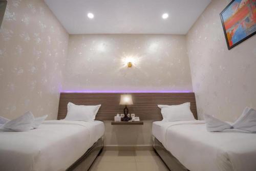 Katil atau katil-katil dalam bilik di De'Tonga Hotel