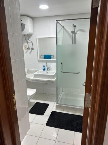a bathroom with a shower and a sink at Neama Bay -Diar El Rabwa Modern pool V in Sharm El Sheikh