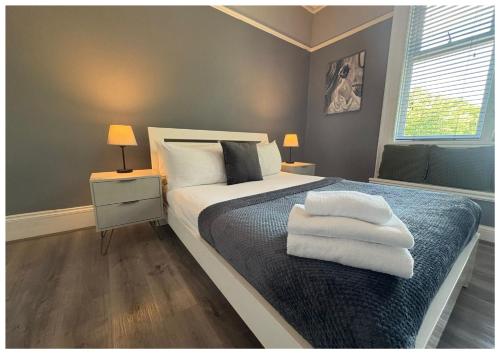 Postel nebo postele na pokoji v ubytování Hotel Anfield