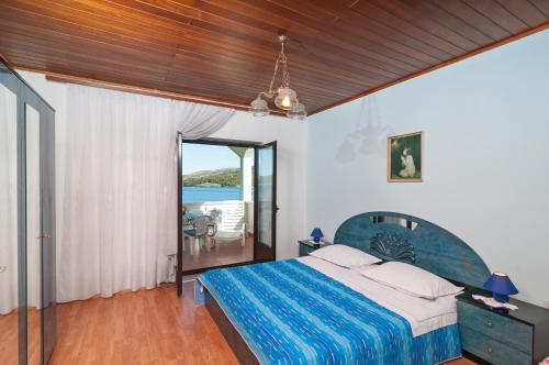 Posteľ alebo postele v izbe v ubytovaní Apartment Stojan A1