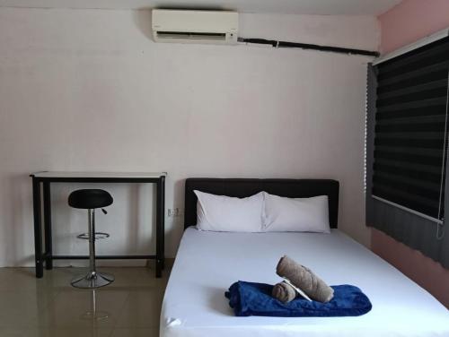 Ein Bett oder Betten in einem Zimmer der Unterkunft JSW PRAMLee Georgetown Penang