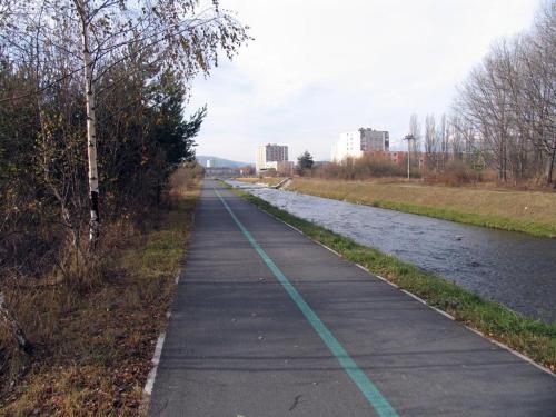 a bike path next to a river at Vysoké Tatry - Svit in Svit