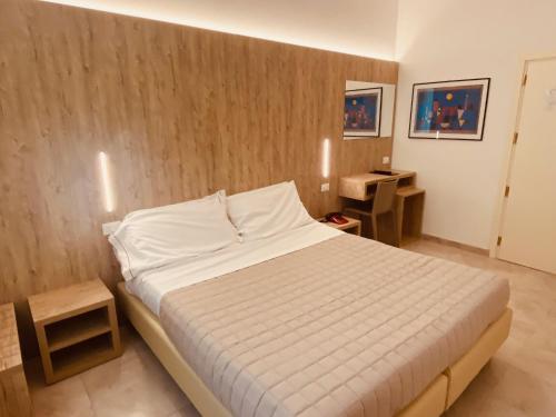 Postel nebo postele na pokoji v ubytování Hotel Montepizzo
