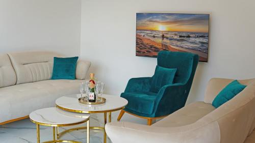 a living room with a couch and two chairs and a table at Villa AntiMar in Međugorje