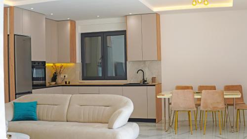 a living room with a couch and a kitchen at Villa AntiMar in Međugorje