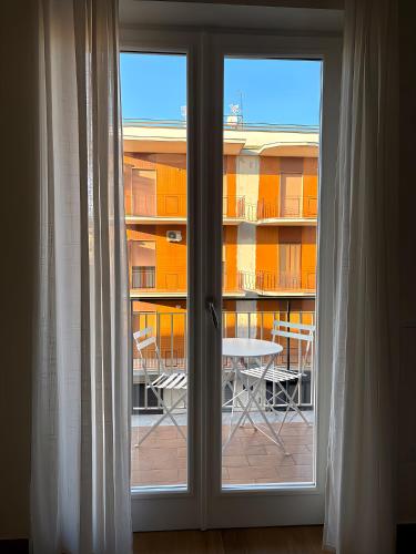 a sliding glass door with a view of a balcony at Art Room In Pompei in Scafati