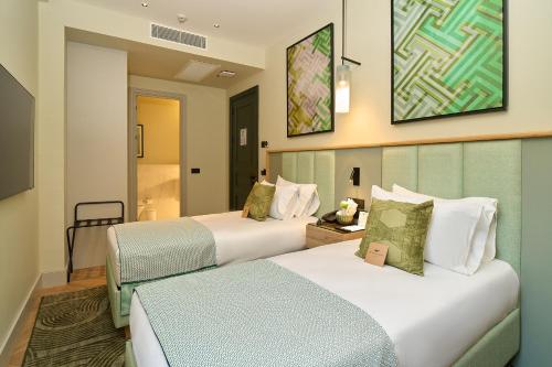 a hotel room with two beds in a room at The Wings Hotels Pera in Istanbul