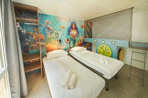 Postel nebo postele na pokoji v ubytování Premium Mobile Homes - Hotel & Resort Adria Ankaran