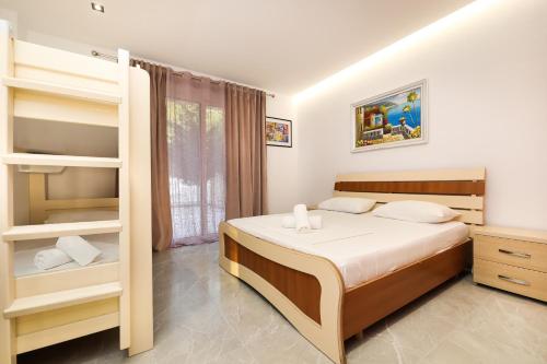 Postel nebo postele na pokoji v ubytování Rezidenca Panorama Apartments