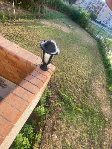 2BR ground chalet with private garden شاليه أرضي غرفتين بحديقة خاصة