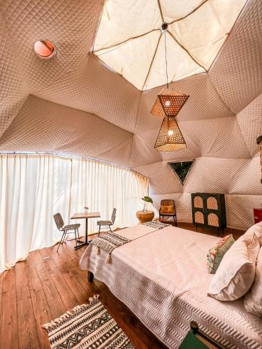 Katil atau katil-katil dalam bilik di River Glamping Boutique Jarabacoa