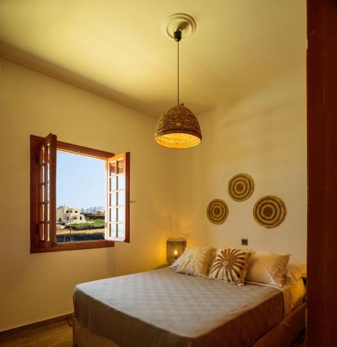 Katil atau katil-katil dalam bilik di Terra Blanca Suites