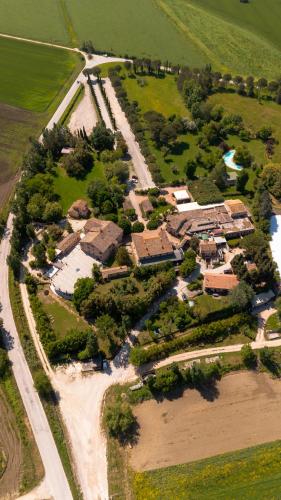 an aerial view of a house in a field at Le Case Resort in Macerata