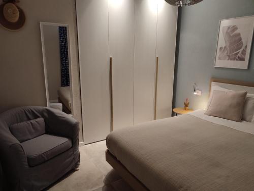 a bedroom with a bed and a chair at Salita al castello in Rossana