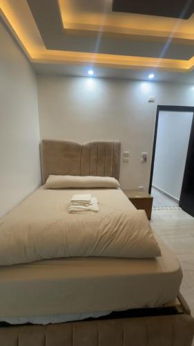 Ένα ή περισσότερα κρεβάτια σε δωμάτιο στο Pyramids Gardens Boutique Hotel New pyramids Gate