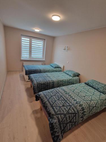 Postel nebo postele na pokoji v ubytování FB Apartaments