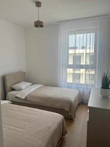 Postel nebo postele na pokoji v ubytování Apartamenty Garbarska