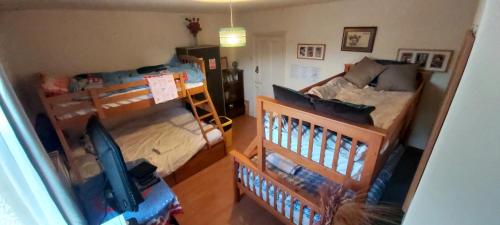 an overhead view of a bedroom with a bunk bed at Phoenix Nights Guest House in Barrow in Furness