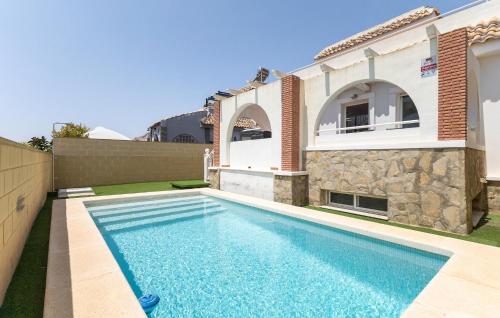 a swimming pool in front of a house at Awesome Home In Avileses in Avileses