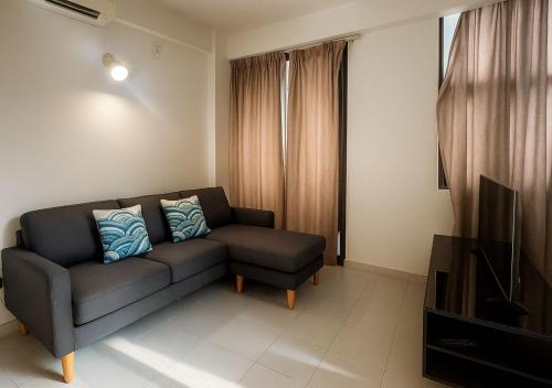 a living room with a couch and a television at Arrival View in Male City