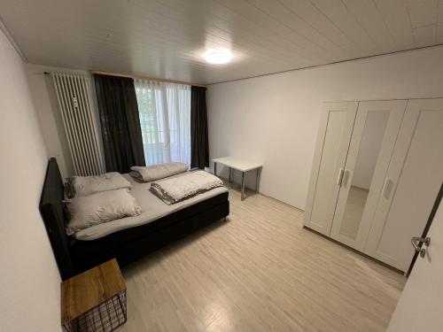a bedroom with a bed in a room with a window at Schöne Maisonette 4 Zimmer mit Garten in Rodgau