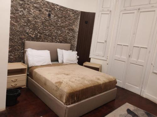 Katil atau katil-katil dalam bilik di Boutique Centro Citta Hotel