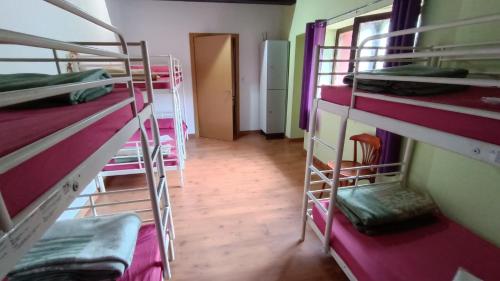 Katil atau katil-katil dalam bilik di Albergue El Caserón de Vidiago