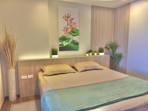 Ένα ή περισσότερα κρεβάτια σε δωμάτιο στο The Terraza Condo