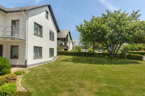 an image of a house with a yard at Bubach in Laubach