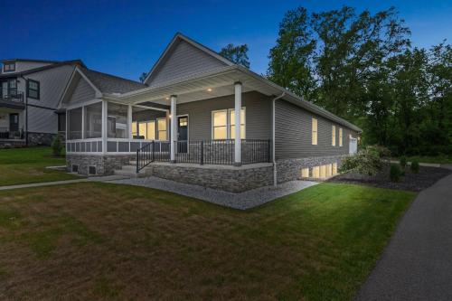 a house with a porch and a lawn at Pet-Friendly Getaway with Golf & Private Patio Retreat home in South Bend