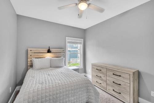 a bedroom with a bed and a ceiling fan at Pet-Friendly Getaway with Golf & Private Patio Retreat home in South Bend
