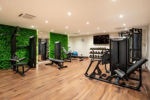a gym with several tread machines in a room at AP Sines - Costa Alentejana in Sines