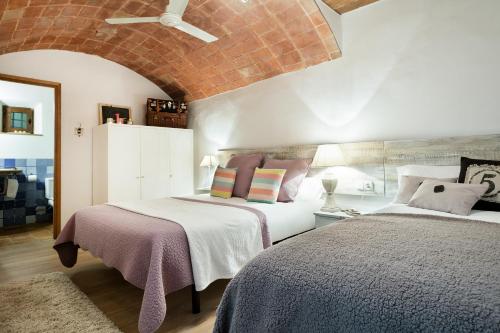 Voodi või voodid majutusasutuse Home Deco Marenya House Costa Brava toas