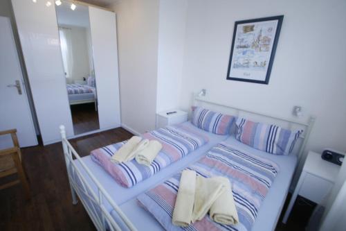 Postel nebo postele na pokoji v ubytování Klabautermann 5