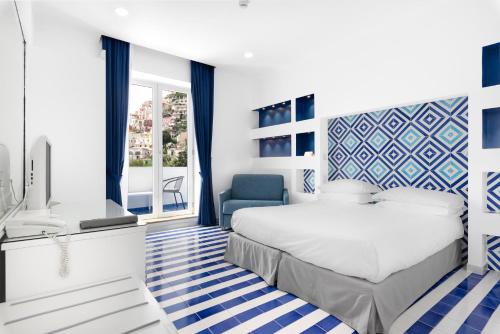 Postel nebo postele na pokoji v ubytování Hotel Bougainville