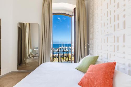 Postel nebo postele na pokoji v ubytování Xilhotel by Perle di Puglia
