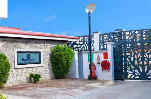 a building with a fire hydrant next to a street light at Homegate Resort in Araromi