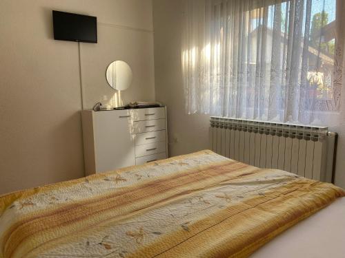 Ένα ή περισσότερα κρεβάτια σε δωμάτιο στο Lav Apartments
