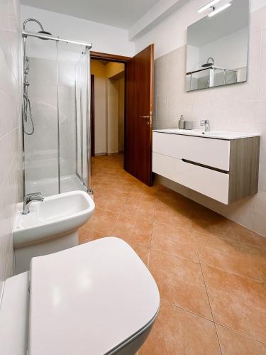 a bathroom with a toilet and a sink and a shower at Al Giardino del Pepe in Lanciano