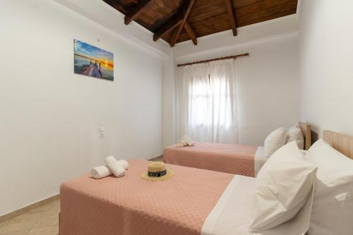 Postel nebo postele na pokoji v ubytování Notio Holiday Home in Laganas
