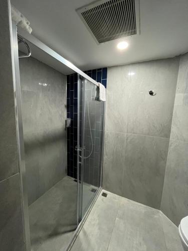 a shower with a glass door in a bathroom at Side Palm D'or Hotel in Side