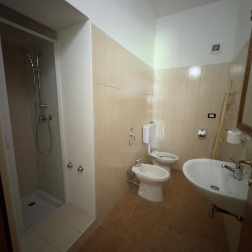a bathroom with a shower and a toilet and a sink at Le Chiancate in San Giovanni Rotondo