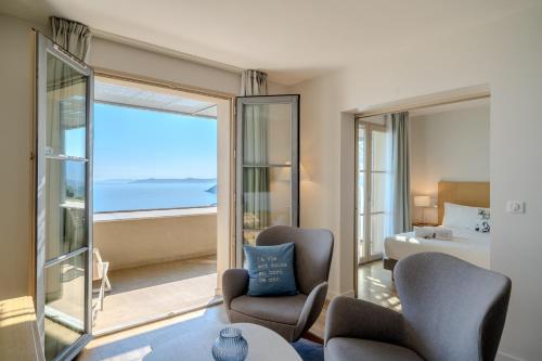 a hotel room with a view of the ocean at Hôtel La Villa Douce in Rayol-Canadel-sur-Mer