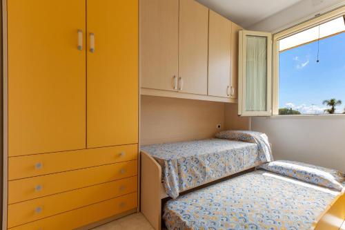 Katil atau katil-katil dalam bilik di Torre Saracena Apartment by BarbarHouse