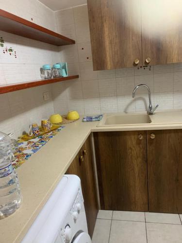 a kitchen with a sink and a counter top at residence Gaja in Gaeta
