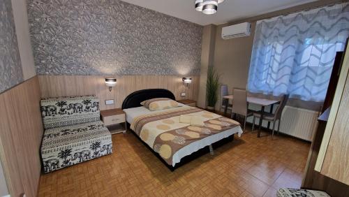 Postel nebo postele na pokoji v ubytování Napsugár Apartmanház