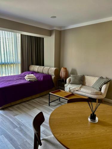 Ένα ή περισσότερα κρεβάτια σε δωμάτιο στο sunny spot