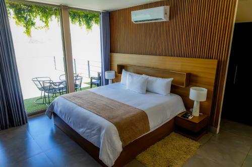 Ένα ή περισσότερα κρεβάτια σε δωμάτιο στο Cardedeu Residence Lago de Coatepeque